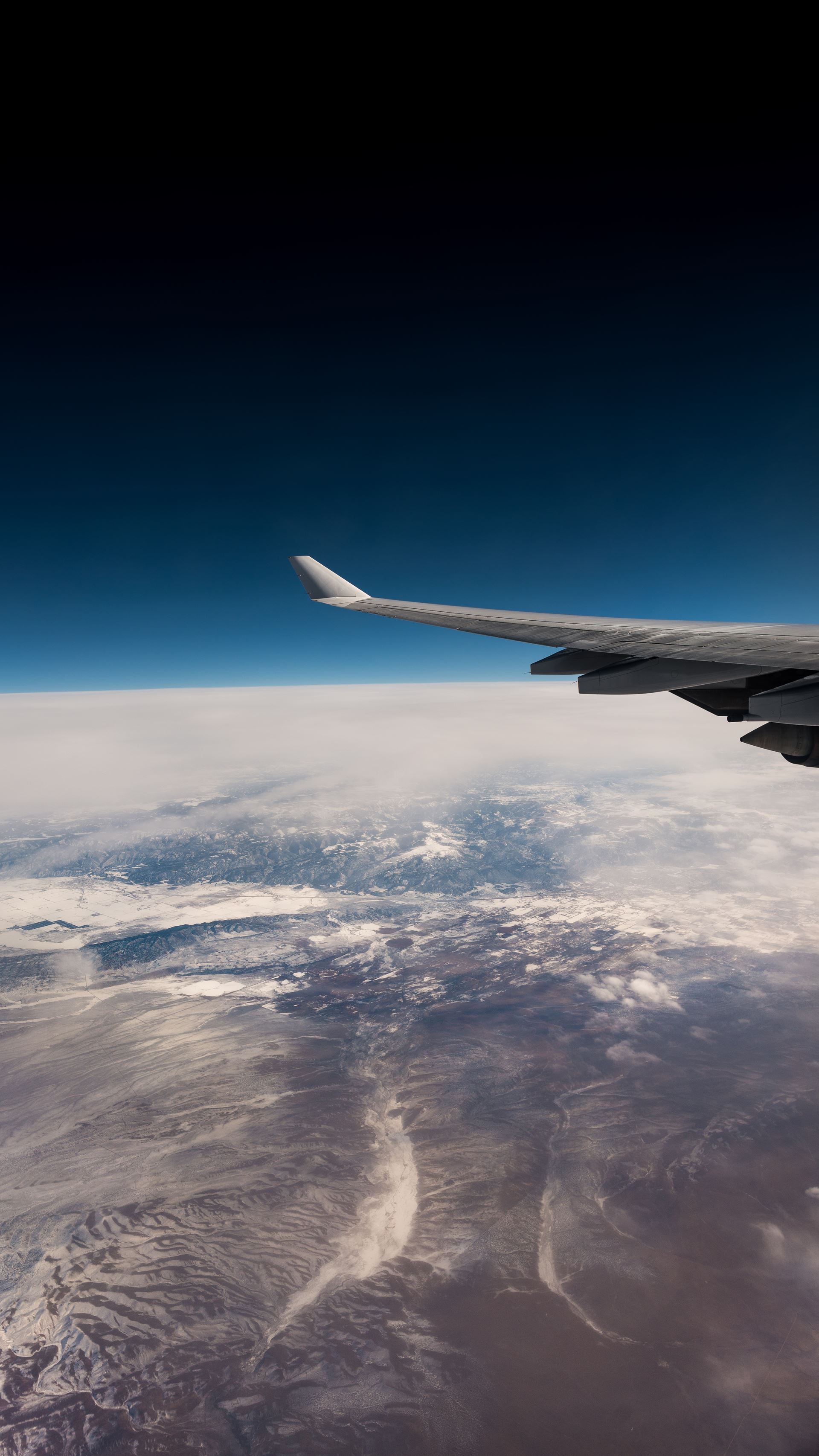 a large airplane flying high up in the air